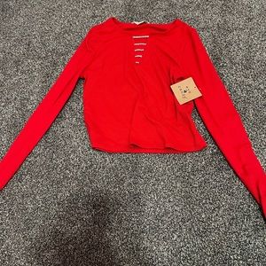 red jeweled crop long sleeve top